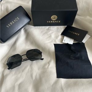 Original Versace glasses are like new, scratch-free, black with gold.